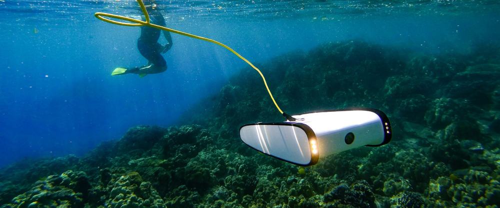 Scuba diver exploring with a drone