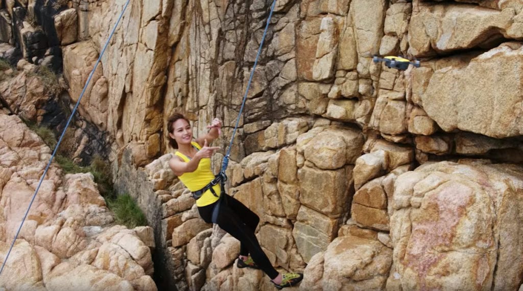 Girl Hiking and taking a selfie with a drone